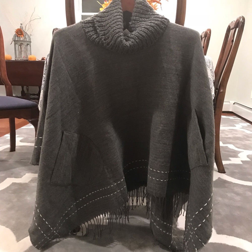 Grey turtleneck poncho with pockets